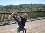 Navasana with a beautiful view of the woods
